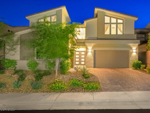 3 Hilltop Crest St, Henderson, NV 89011 - view of front of house with stucco siding, decorative driveway, and an attached garage