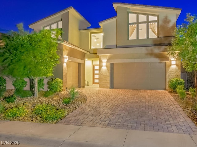 3 Hilltop Crest St, Henderson, NV 89011 - view of front of property with a garage, stucco siding, and decorative driveway