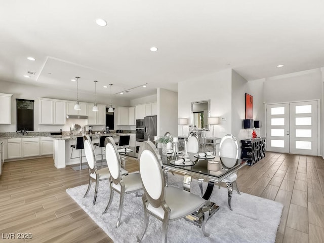 3 Hilltop Crest St, Henderson, NV 89011 - dining room with light wood-style flooring, recessed lighting, and french doors