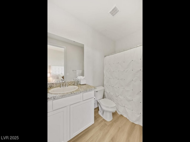 3 Hilltop Crest St, Henderson, NV 89011 - full bath with toilet, vanity, wood finished floors, and a shower with curtain
