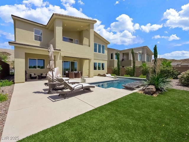 3 Hilltop Crest St, Henderson, NV 89011 - back of house featuring stucco siding, an outdoor hangout area, a patio area, and an outdoor pool