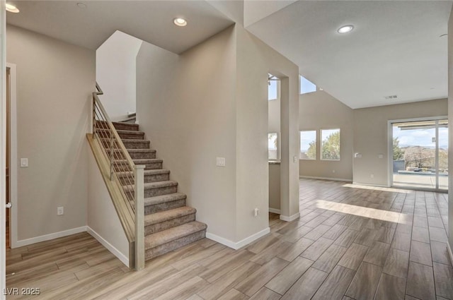 3 Hilltop Crest St, Henderson, NV 89011 - stairway with baseboards, wood finished floors, recessed lighting, and vaulted ceiling