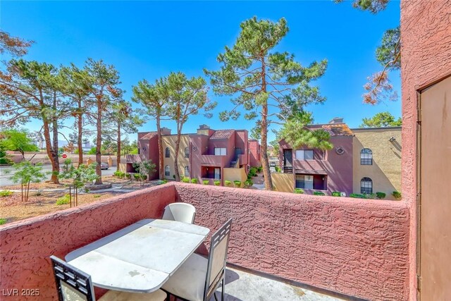 4050 Pacific Harbors Dr Unit 245, Las Vegas, NV 89121 - balcony featuring a residential view and outdoor dining area