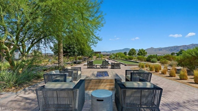 4200 E Brusca Way, Pahrump, NV 89061 - view of patio / terrace featuring a fire pit and a mountain view