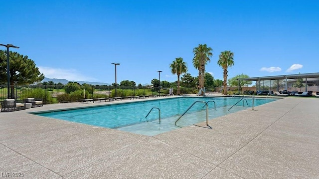 4200 E Brusca Way, Pahrump, NV 89061 - community pool featuring a patio area and a mountain view