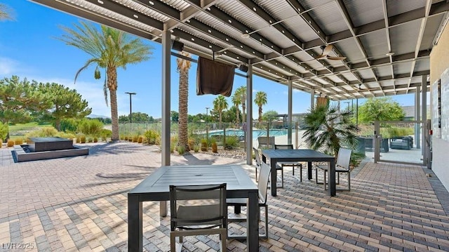 4200 E Brusca Way, Pahrump, NV 89061 - view of patio / terrace with outdoor dining area, a hot tub, and an outdoor pool