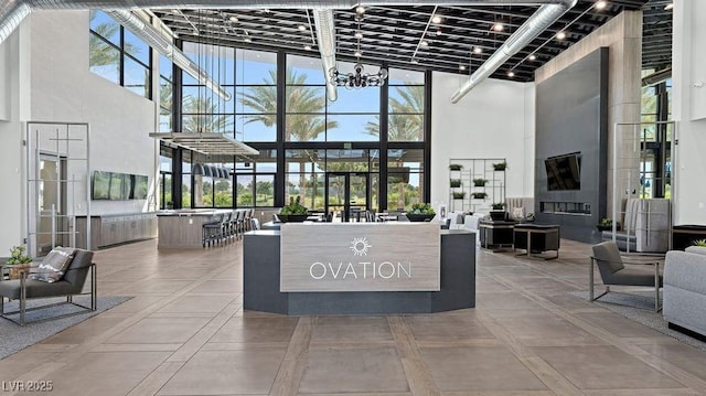 4200 E Brusca Way, Pahrump, NV 89061 - reception featuring a high ceiling, a chandelier, and expansive windows