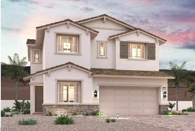 187 Jaldena Ln, Henderson, NV 89011 - view of front of property featuring an attached garage, stone siding, and stucco siding