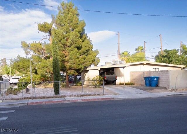 2001 E Mcwilliams Ave, Las Vegas, NV 89101 - view of front of property with concrete driveway, stucco siding, and an attached carport