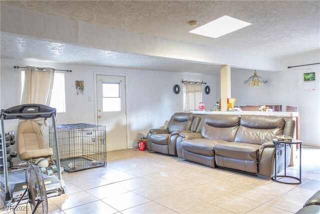 2001 E Mcwilliams Ave, Las Vegas, NV 89101 - living area with a textured ceiling, tile patterned flooring, and a skylight