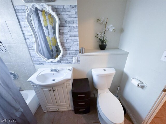 2001 E Mcwilliams Ave, Las Vegas, NV 89101 - bathroom featuring vanity, tile patterned floors, toilet, and shower / tub combo with curtain
