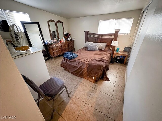 2001 E Mcwilliams Ave, Las Vegas, NV 89101 - bedroom with multiple windows and light tile patterned floors