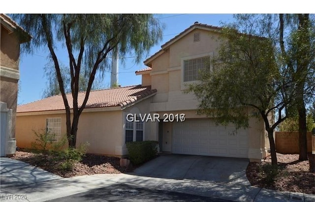 7518 Luna Del Rey St, Las Vegas, NV 89123 - view of front of property with a tile roof, stucco siding, a garage, and concrete driveway
