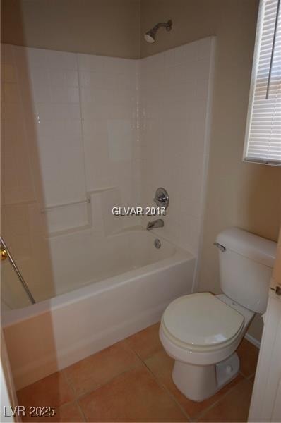 7518 Luna Del Rey St, Las Vegas, NV 89123 - full bath with shower / bath combination, toilet, and tile patterned floors
