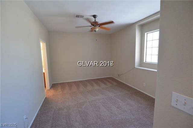 7518 Luna Del Rey St, Las Vegas, NV 89123 - spare room with a ceiling fan, carpet floors, and baseboards