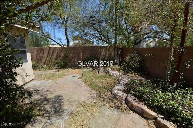 7518 Luna Del Rey St, Las Vegas, NV 89123 - fenced backyard with a patio area