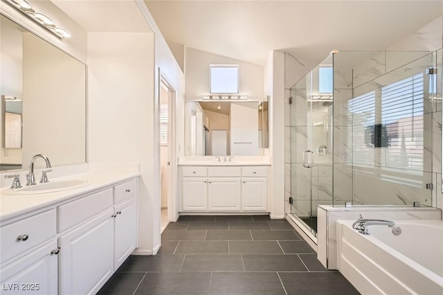 10241 Regents Cross Pl, Las Vegas, NV 89144 - full bath with a stall shower, vaulted ceiling, two vanities, a bath, and tile patterned flooring