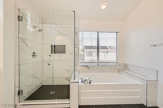10241 Regents Cross Pl, Las Vegas, NV 89144 - bathroom featuring a bath and a shower stall