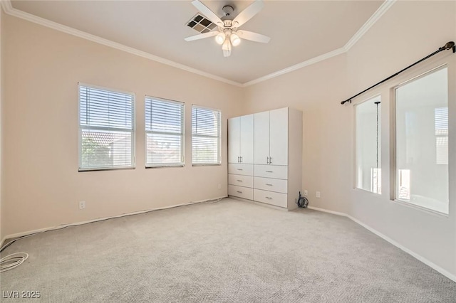 10241 Regents Cross Pl, Las Vegas, NV 89144 - unfurnished bedroom with crown molding, light carpet, baseboards, and ceiling fan