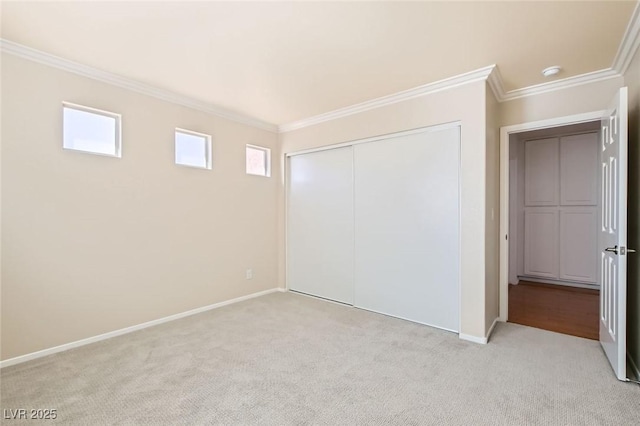 10241 Regents Cross Pl, Las Vegas, NV 89144 - unfurnished bedroom featuring light carpet, crown molding, baseboards, and a closet