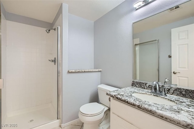 10241 Regents Cross Pl, Las Vegas, NV 89144 - bathroom with a shower stall, toilet, vanity, and tile patterned floors