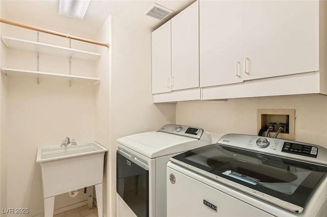 10241 Regents Cross Pl, Las Vegas, NV 89144 - laundry room featuring cabinet space and washer and dryer