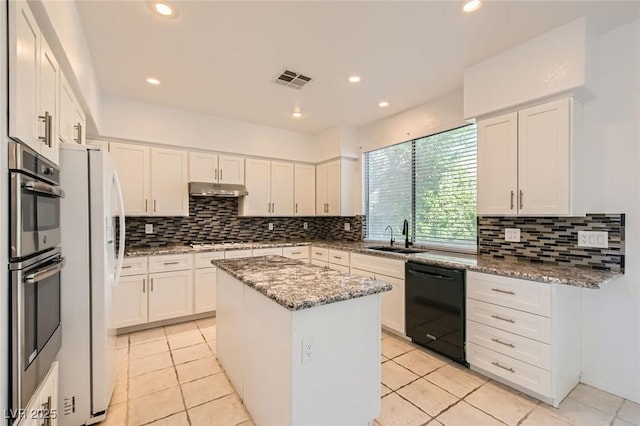 10241 Regents Cross Pl, Las Vegas, NV 89144 - kitchen featuring dishwasher, a sink, a center island, tasteful backsplash, and recessed lighting