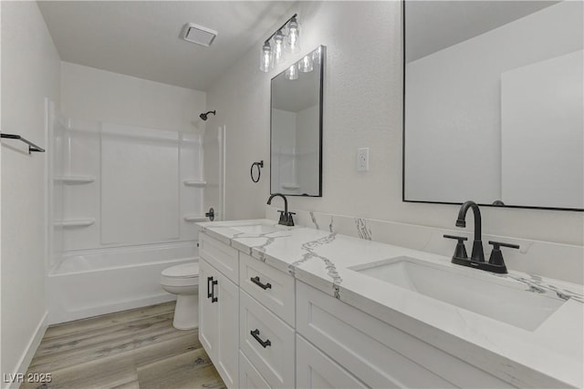 1901 Farnam Pl, Las Vegas, NV 89102 - full bathroom with toilet, wood finished floors, shower / washtub combination, and double vanity