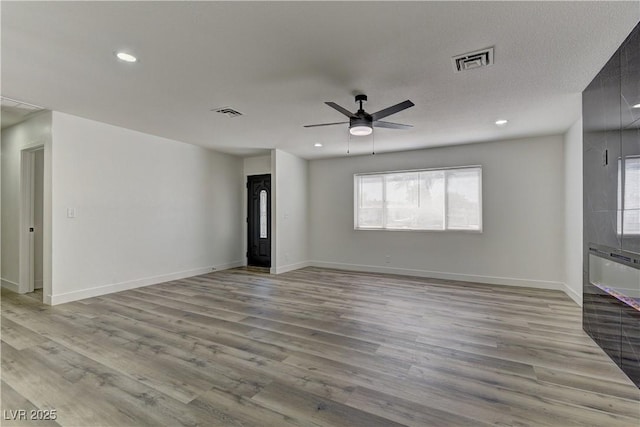 1901 Farnam Pl, Las Vegas, NV 89102 - unfurnished living room with a ceiling fan, light wood-style floors, baseboards, and recessed lighting