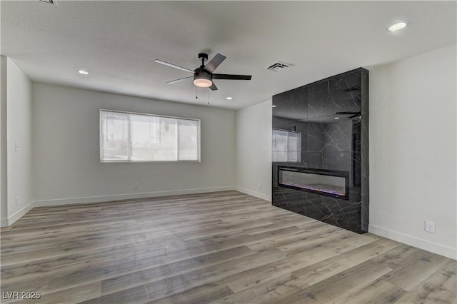 1901 Farnam Pl, Las Vegas, NV 89102 - unfurnished living room featuring wood finished floors, ceiling fan, a fireplace, recessed lighting, and baseboards