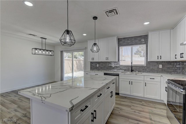 1901 Farnam Pl, Las Vegas, NV 89102 - kitchen featuring a sink, stainless steel appliances, backsplash, recessed lighting, and light wood finished floors