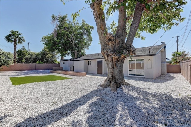 1901 Farnam Pl, Las Vegas, NV 89102 - back of property with a fenced backyard, a patio area, and stucco siding