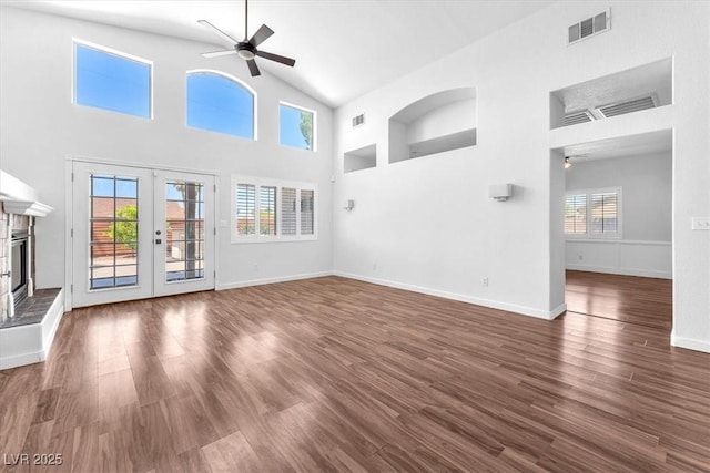 1088 Casady Hollow Ave, Henderson, NV 89012 - unfurnished living room featuring a ceiling fan, high vaulted ceiling, dark wood-type flooring, french doors, and baseboards