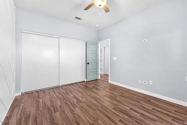 1088 Casady Hollow Ave, Henderson, NV 89012 - unfurnished bedroom featuring wood finished floors, a closet, baseboards, and ceiling fan