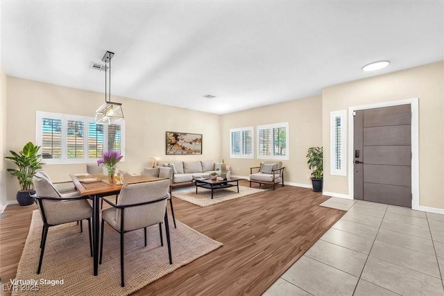 1088 Casady Hollow Ave, Henderson, NV 89012 - dining space with healthy amount of natural light, wood finished floors, and baseboards