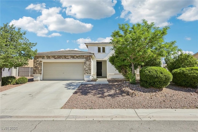 564 Lampshire Ln, Pahrump, NV 89060 - view of front of house with stone siding, a garage, concrete driveway, and stucco siding
