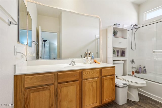 564 Lampshire Ln, Pahrump, NV 89060 - full bath featuring toilet, vanity, wood finished floors, and combined bath / shower with glass door