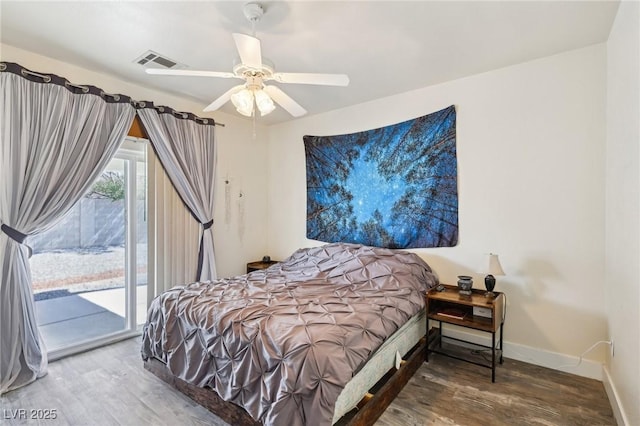 564 Lampshire Ln, Pahrump, NV 89060 - bedroom with wood finished floors, access to exterior, baseboards, and a ceiling fan