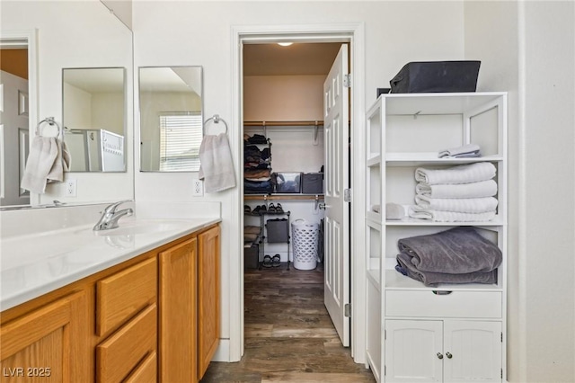564 Lampshire Ln, Pahrump, NV 89060 - bathroom with wood finished floors, vanity, and a spacious closet
