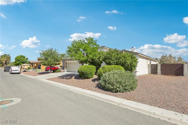 564 Lampshire Ln, Pahrump, NV 89060 - obstructed view of property with an attached garage and driveway