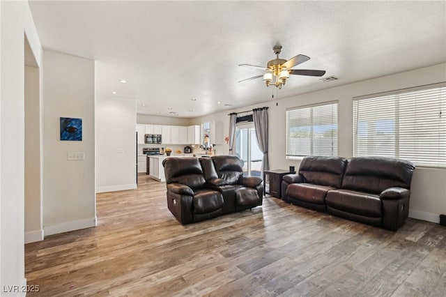 564 Lampshire Ln, Pahrump, NV 89060 - living area featuring ceiling fan, light wood finished floors, baseboards, and recessed lighting