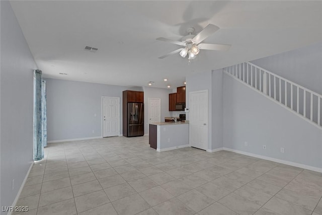 1130 Blissful Plains Ave, North Las Vegas, NV 89086 - unfurnished living room with light tile patterned floors, a ceiling fan, stairs, recessed lighting, and baseboards