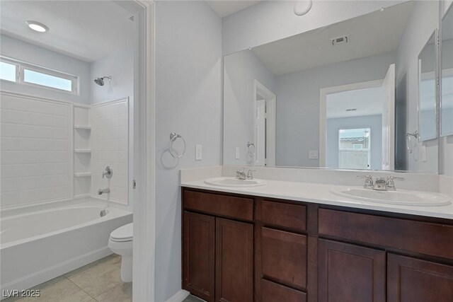 1130 Blissful Plains Ave, North Las Vegas, NV 89086 - bathroom featuring toilet, double vanity, plenty of natural light, and bathing tub / shower combination