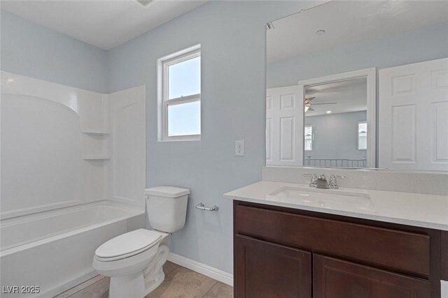 1130 Blissful Plains Ave, North Las Vegas, NV 89086 - bathroom featuring vanity, toilet, a ceiling fan, baseboards, and shower / bath combination