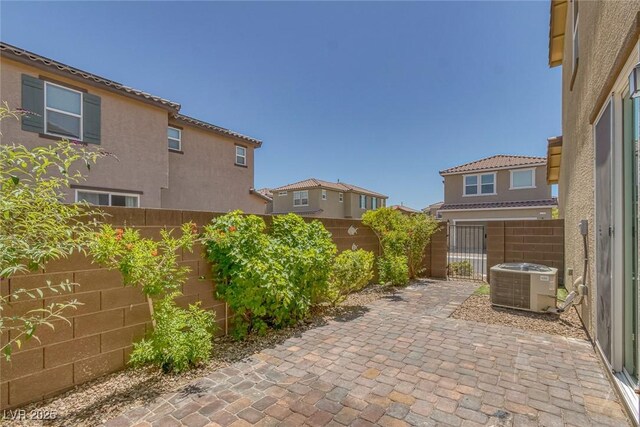 1130 Blissful Plains Ave, North Las Vegas, NV 89086 - fenced backyard featuring central AC and a patio area