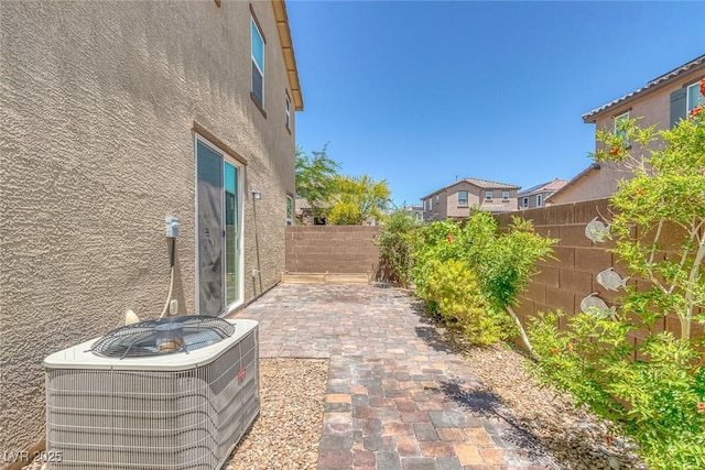 1130 Blissful Plains Ave, North Las Vegas, NV 89086 - fenced backyard featuring central AC unit and a patio area
