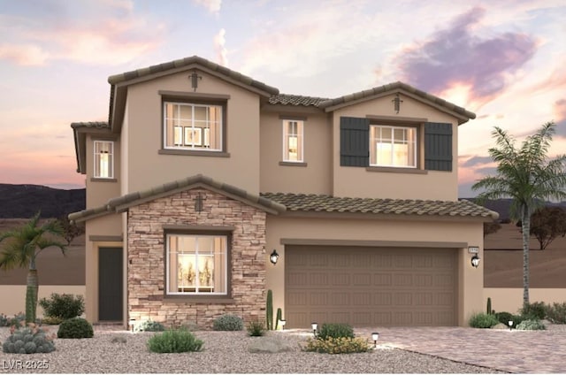 188 Kobuk Ave, Henderson, NV 89011 - view of front of home with a tiled roof, stone siding, and a garage