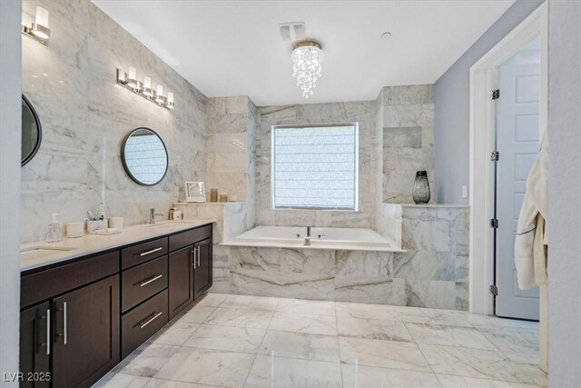881 Barrhead Ave, Henderson, NV 89012 - full bath with tile walls, a bath, double vanity, and marble finish floors