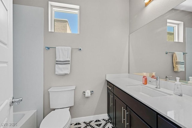 881 Barrhead Ave, Henderson, NV 89012 - bathroom featuring vanity, toilet, baseboards, and a bathtub