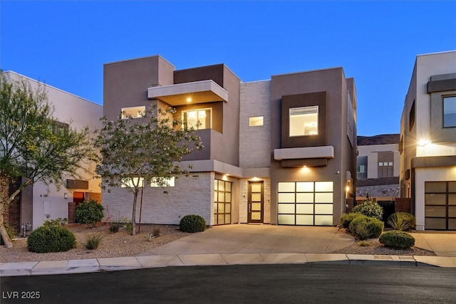 881 Barrhead Ave, Henderson, NV 89012 - modern home with a garage, concrete driveway, and stucco siding